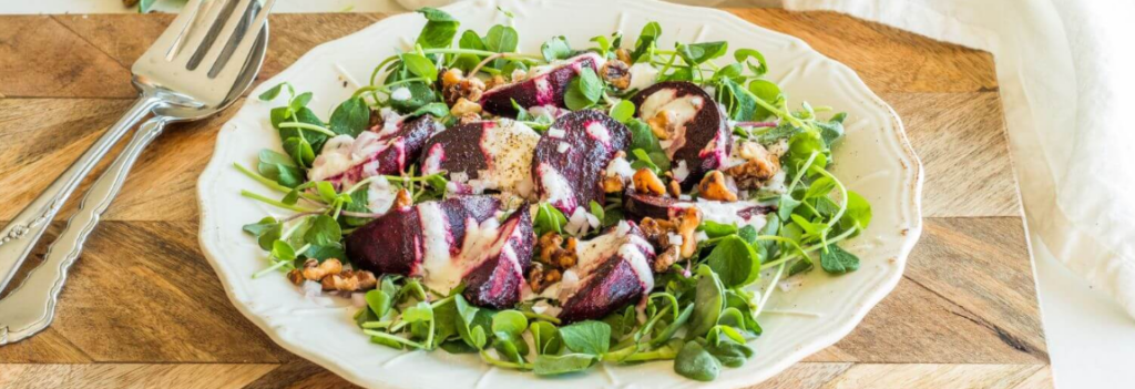 A white plate of beet salad